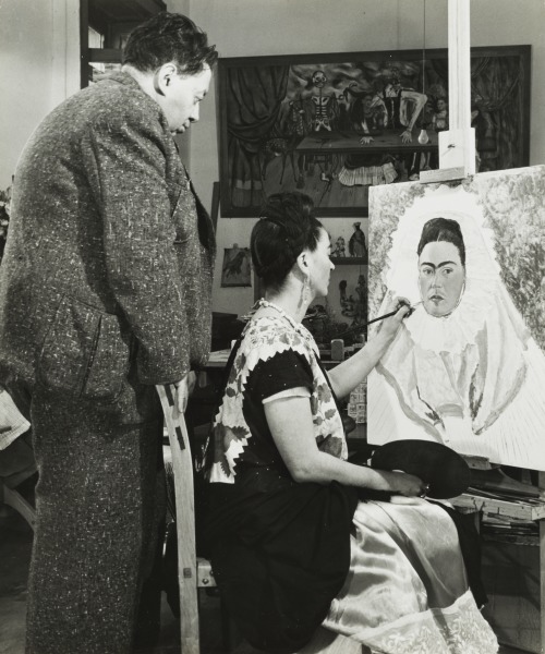 Diego Rivera Watching Frida Kahlo Paint a Self Portrait